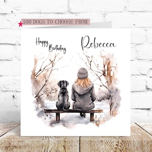 May include: A personalized birthday card featuring a watercolor illustration of a woman and a black dog sitting on a bench in a snowy forest. The card says "Happy Birthday Rebecca".