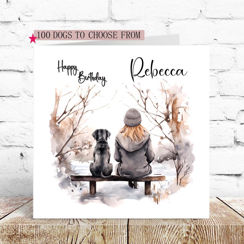 May include: A personalized birthday card featuring a watercolor illustration of a woman and a black dog sitting on a bench in a snowy forest. The card says "Happy Birthday Rebecca".