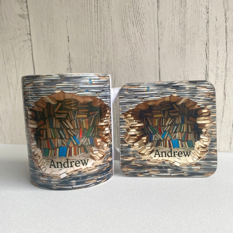 May include: A white ceramic mug and coaster with a design of a brick wall with a hole revealing a stack of colorful books. The mug and coaster are personalized with the name "Andrew".