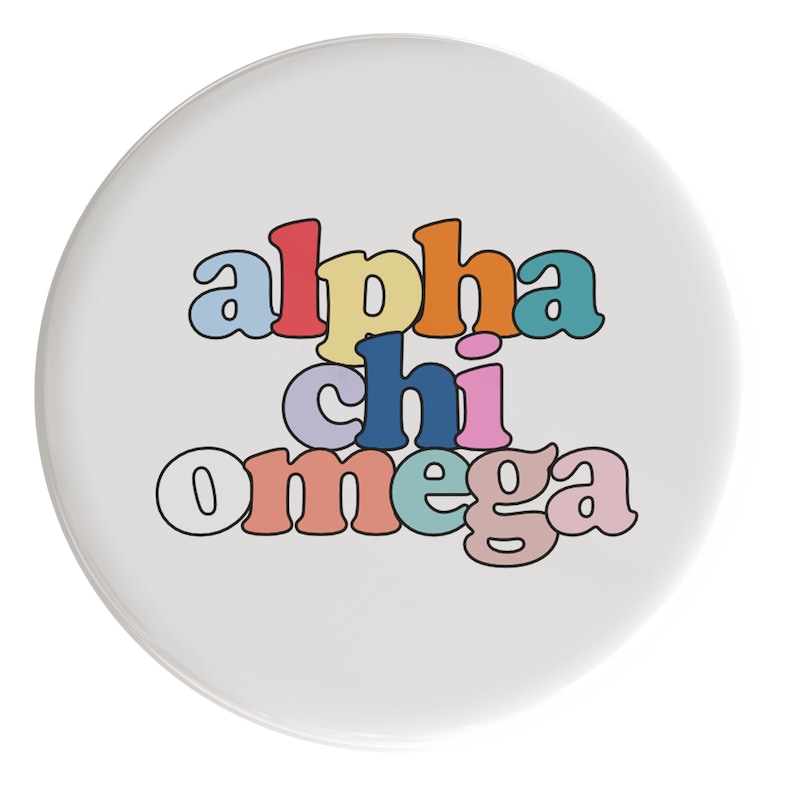 May include: A white button with the text "alpha chi omega" in rainbow colors.