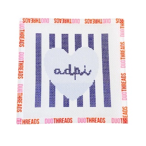 May include: A square needlepoint canvas featuring a white background with vertical dark blue stripes. A large white heart is centered over the stripes, containing the lowercase text adpi in dark blue. The border repeats the text DUOTHREADS.