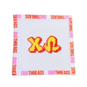 May include: A square white needlepoint canvas featuring a grid pattern. In the center, the letters X and U are stitched in yellow with a red outline. The border of the canvas is printed with the repeating text DUOTHREADS in pink and orange.