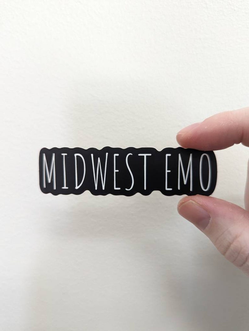 May include: Black and white sticker with the text "MIDWEST EMO" in a wavy font.