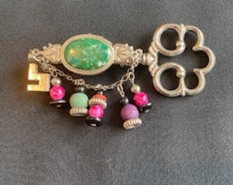 Key Pin/Brooch/Necklace made from vintage key pin, upcycled earrings, and chain.