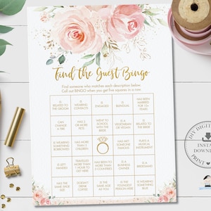 May include: A pink and gold floral themed bridal shower game card with the title "Find the Guest Bingo". The card has a 5x5 grid with various bingo squares such as "Is Engaged", "Has Been Married for 10+ Years", "Is a Vegetarian or Vegan", "Plays a Musical Instrument", and "Is Wearing Something Blue".