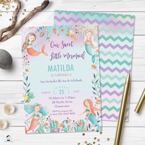 May include: A light blue invitation with a watercolor illustration of mermaids, seashells, and sea life. The text reads "Our Sweet Little Mermaid Matilda is turning 5. Join us under the sea to celebrate. Saturday, March 25, 20XX. 10:30am to 1:30pm. 58 Pacific Drive, Oceanview. RSVP by August 5th to Jane 555-4669-8896."