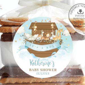 May include: Blue and brown baby shower favor tags with a watercolor illustration of a Noah's Ark with animals. The text reads "It's a Boy!" and includes the name "Katherine's Baby Shower" and a date.