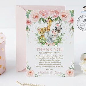 May include: A pink and green thank you card featuring a floral wreath and illustrations of a giraffe, zebra, lion, and elephant. The text reads "Thank You for celebrating with us!" and includes a short poem expressing gratitude for gifts and wishes. The card is signed "Madison & James".