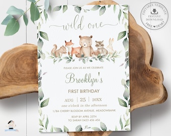 May include: A woodland-themed first birthday invitation. The design includes watercolour illustrations of woodland animals such as a squirrel, fox, bear, raccoon, and rabbit. The text reads "wild one" and includes the birthday details.