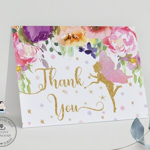 May include: Thank you card with a pink fairy with gold glitter wings and a floral border. The card has a white background with gold glitter text that says "Thank You".
