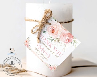 May include: A white candle with a pink floral design thank you tag. The tag says "Thank You for celebrating with us! Madison's Bridal Shower 08.25.20XX".