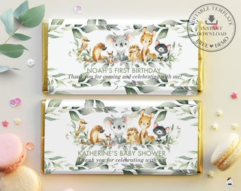May include: Two chocolate bar wrappers with a gold border and a white background. The wrappers feature a watercolor illustration of a koala, a kangaroo, an echidna, an otter, and a cat. The top wrapper has the text "Noah's First Birthday" and "Thank you for coming and celebrating with me!" The bottom wrapper has the text "Katherine's Baby Shower" and "Thank you for celebrating with us!"