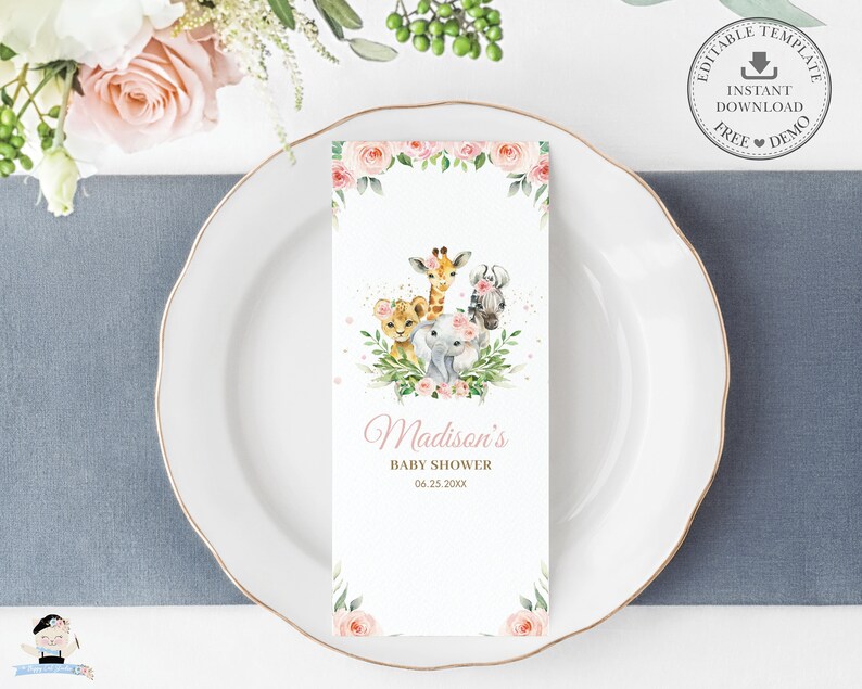 May include: A white baby shower invitation card with illustrations of a lion, giraffe, elephant, and monkey. The card reads "Madison's Baby Shower" and the date. The design is completed with floral accents and a decorative border.