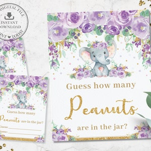 Peut inclure: Jeu de baby shower floral avec des fleurs violettes et dorées et un adorable éléphant gris portant une couronne de fleurs. Le jeu demande aux invités de deviner le nombre de cacahuètes dans le bocal.