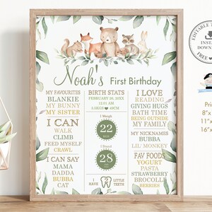 May include: A green and gold printable first birthday poster with a woodland theme. The poster features a cute bear, fox, rabbit, and raccoon. The poster includes the child's name, Noah, and details about their first year, including their birth stats, favourite things, and what they can do. The poster is perfect for a first birthday party.
