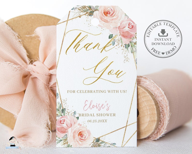 May include: A white thank you tag with gold geometric shapes and floral illustrations. The text reads "Thank You" in gold script, "For celebrating with us!" and "Eloise's Bridal Shower 06.25.20XX".