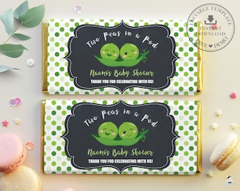 May include: Two green peas in a pod with smiling faces on a chalkboard background with the text "Two peas in a pod" and "Naomi's Baby Shower" with green polka dots on the background.