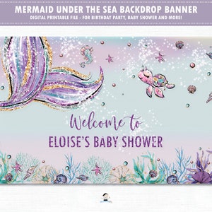 Op de afbeelding: Een paarse en gouden glitter-zeemeerminstaart met een zeeschildpad en een zeester op een blauwe en paarse ombre-achtergrond. De tekst "Welkom op Eloise's Baby Shower" staat op de banner.
