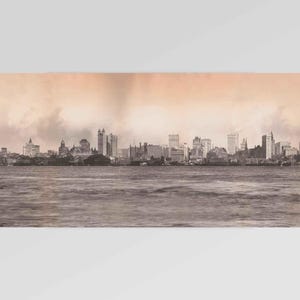 May include: A sepia-toned print depicting a cityscape, possibly a coastal city, with water in the foreground. The skyline showcases various buildings, including skyscrapers and older architecture, beneath a cloudy sky.