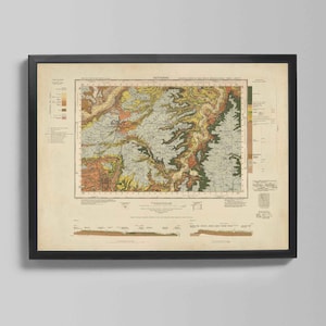 May include: Framed vintage map print in a black frame. The map shows a detailed geological survey with various colours representing different land formations. The map is labelled "KETTERING" at the top.