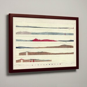 May include: A framed print featuring a detailed, vintage geological map. The map displays horizontal bands with varying colors and textures, including red, blue, and brown, representing different geological formations. The frame is a dark, rich brown.