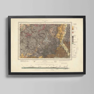 May include: Framed vintage map print with a detailed geological survey of North Carolina. The map features a complex network of lines and color-coded areas in shades of gray, brown, yellow, and pink. The print is set in a black frame.