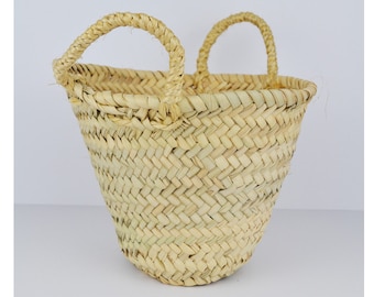 Small conical basket made of palm leaves