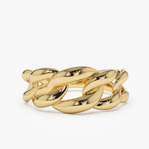May include: A gold chain link ring with a thick, chunky design.