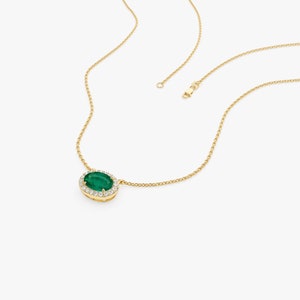 14k Gold Oval Shape Emerald in Diamond Halo Setting Side Angle