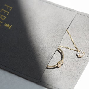 14k White Gold Mini Diamond Cross that looks like a North Star Pendant packaging