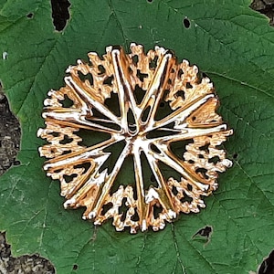 Vendome gold tone starburst style brooch