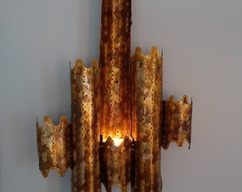 Brutalist metal art or torch cut art wall sconce, by Edward Oliver