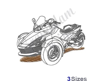 May include: An embroidered design of a three-wheeled motorcycle, rendered in shades of gray and white. The design features a detailed outline of the vehicle, including the front headlights, windshield, and seat. The text "3 Sizes" is visible at the bottom.