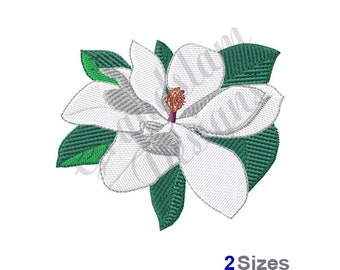May include: White magnolia flower with green leaves. The flower has a white center with a purple stigma.