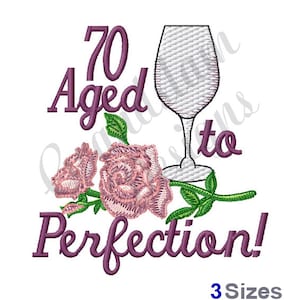 May include: Embroidered design featuring a wine glass, two pink roses, and the text "70 Aged to Perfection!" in purple.
