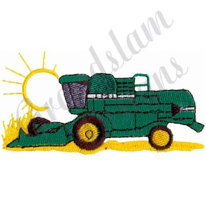 May include: A green combine harvester with a brown and yellow wheel, working in a field of yellow wheat under a yellow sun.