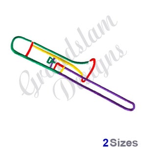 Puede incluir: Un diseño de bordado de un trombón en verde, amarillo, rojo y morado.