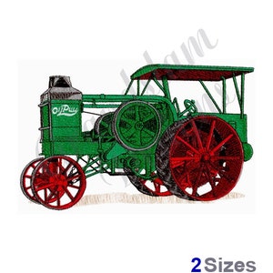 Puede incluir: Tractor vintage verde y rojo con una capota y el texto "Oil Pull" en el lateral.