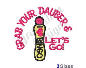 May include: Pink and yellow embroidery design of a bingo dauber with the text "Grab Your Daubers & Let's Go!"