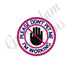 May include: Embroidered patch with a circular design. The patch features a pink border with the words "PLEASE DON'T PET ME I'M WORKING" in blue. A black hand with a red line through it is in the center.