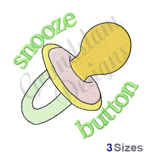 May include: An embroidered design of a pacifier in green and yellow with the text "Snooze Button".
