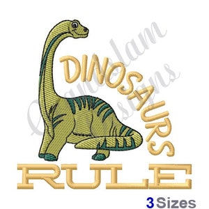 May include: Embroidered design featuring a green dinosaur with the text "Dinosaurs Rule" in yellow. The design is available in three sizes.