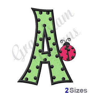 May include: Green letter A with black polka dots and a red ladybug with black spots on the right side. The text "2 Sizes" is below the letter.