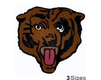 May include: Brown and black embroidered bear head with a pink tongue sticking out. The bear has a fierce expression with black eyes and a black nose.