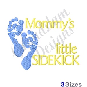 May include: Mommy's little sidekick embroidery design featuring two blue baby footprints and yellow text.