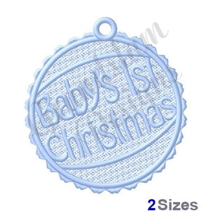 May include: Blue and white embroidered ornament with the text "Baby's 1st Christmas".