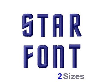 May include: A blue embroidered font design with the words "STAR FONT" in a bold, blocky style. The text is in two sizes, with the word "STAR" being larger than the word "FONT".