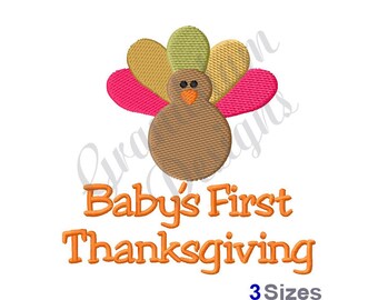 May include: Embroidered design of a brown turkey with a pink and yellow tail feathers. The text "Baby's First Thanksgiving" is below the turkey in orange. The text "3 Sizes" is below the text in orange.
