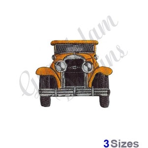 May include: A vintage yellow car with black wheels and a chrome grill. The car is facing forward and has a black roof.