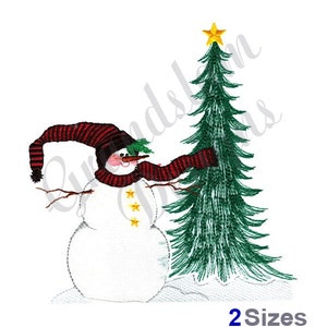 May include: A snowman wearing a red and black striped hat and scarf stands next to a green Christmas tree with a yellow star on top. The snowman has a carrot nose and three yellow buttons.